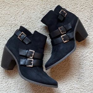 Black buckle boots with a heel